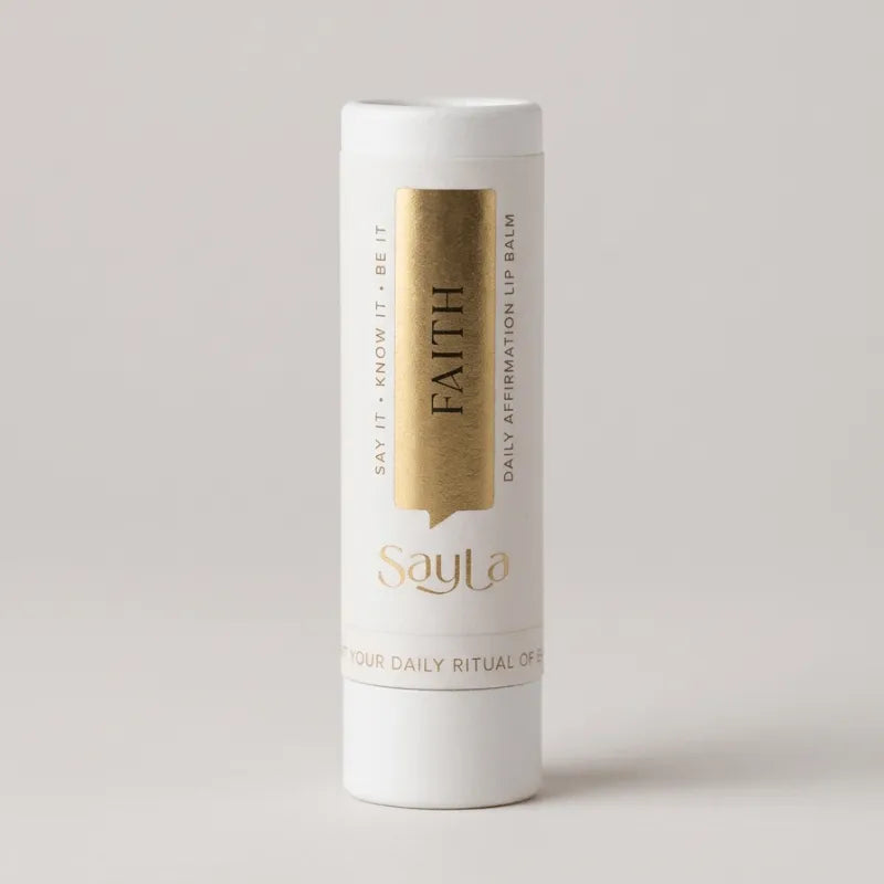 Sayla Faith lip balm on a light gray background