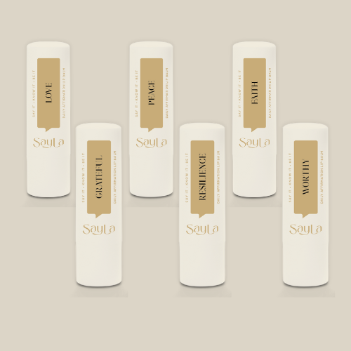 Six SayLa organic lip balms with affirmation themes, clean lip care gift set