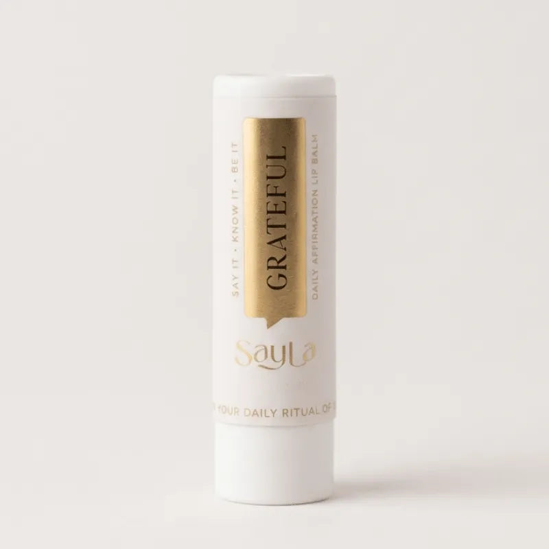 Sayla 'Grateful' lip balm on a white background