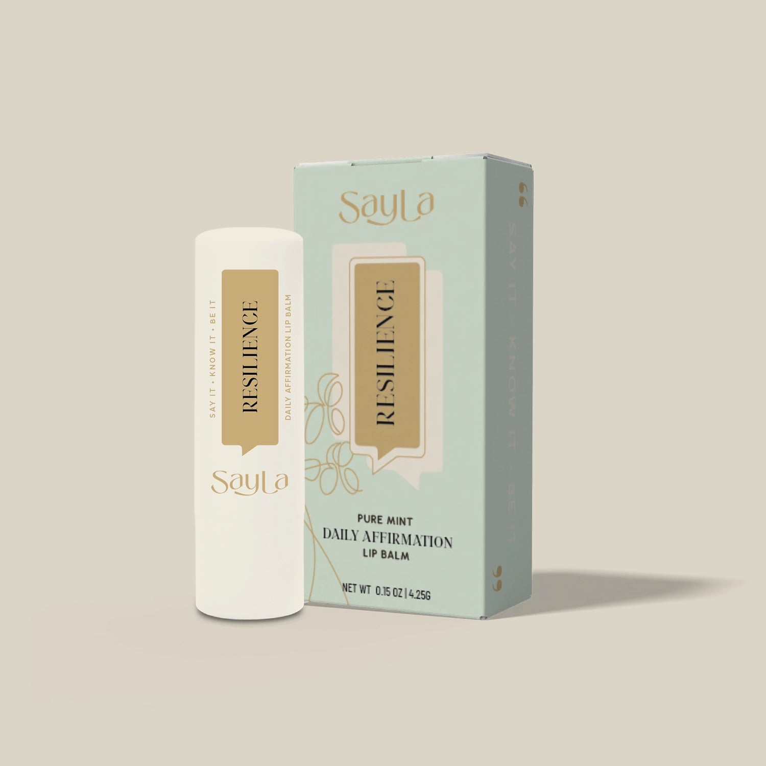 Sayla Resilience lip balm and packaging on a beige background
